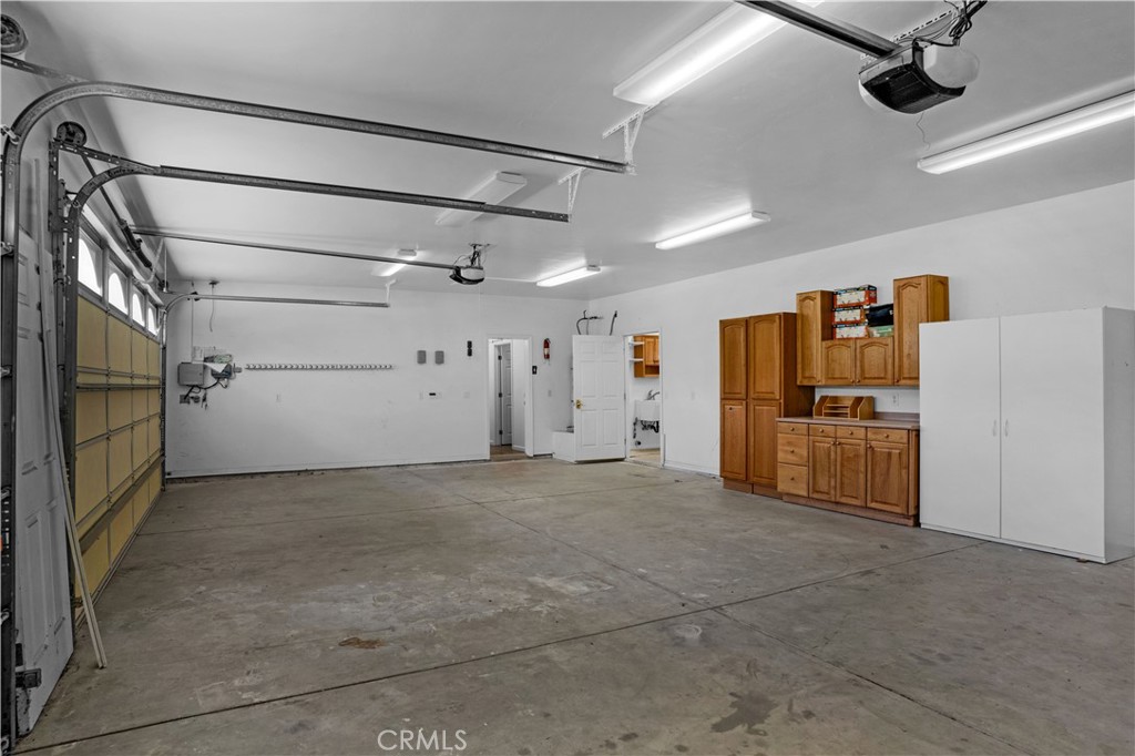 29781 Pasada Road Temecula, CA 92591 - Photo 41 of 58 Garage with entry to house and workshop