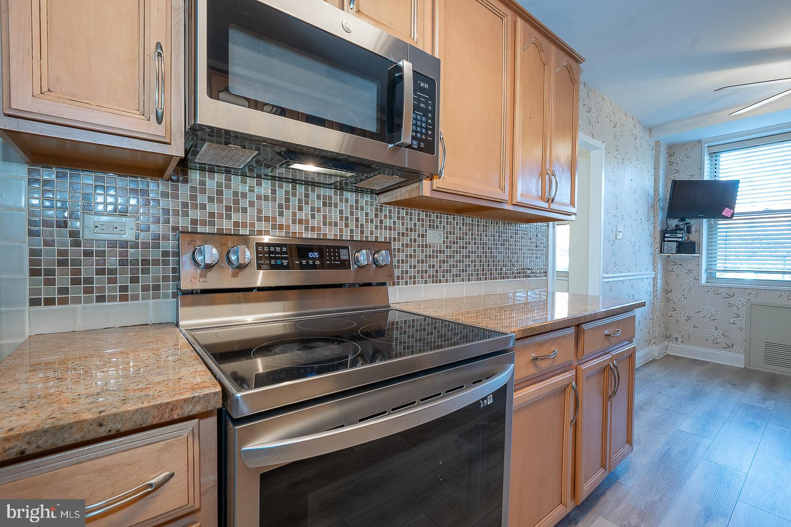 20 Conshohocken State Road, Unit 203 Bala Cynwyd, PA 19004 - Photo 13 of 35 a kitchen with stainless steel appliances and cabinets