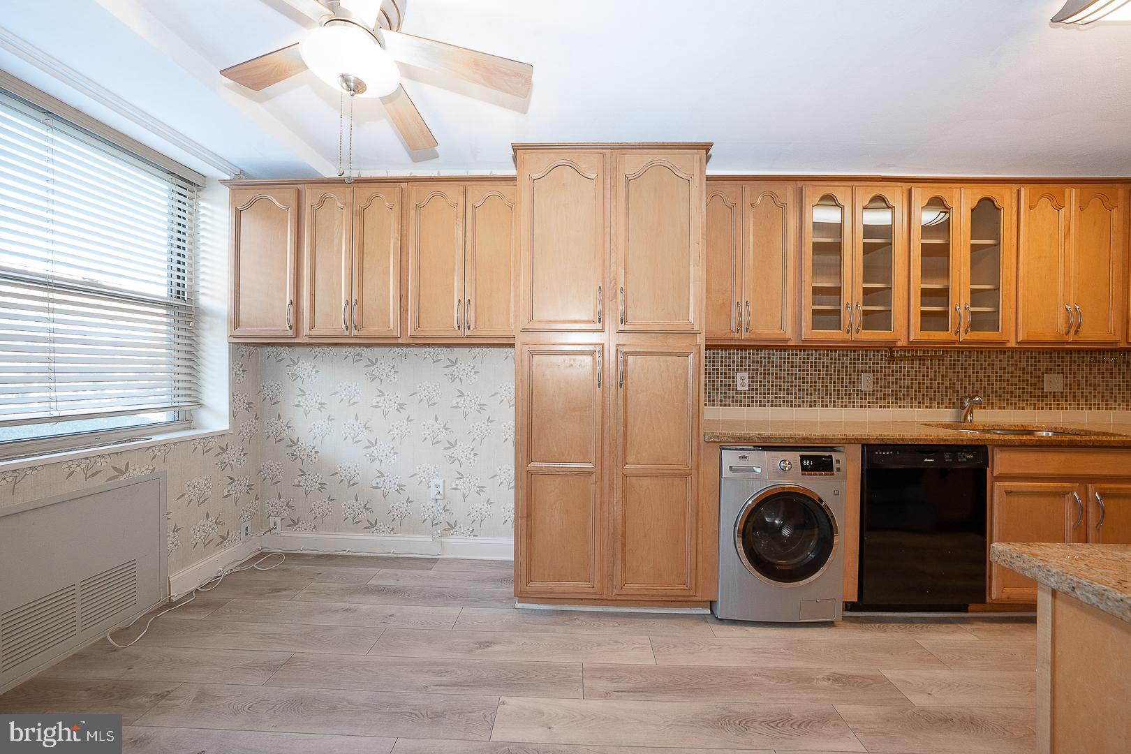 20 Conshohocken State Road, Unit 203 Bala Cynwyd, PA 19004 - Photo 17 of 35 a kitchen with a stove and a refrigerator