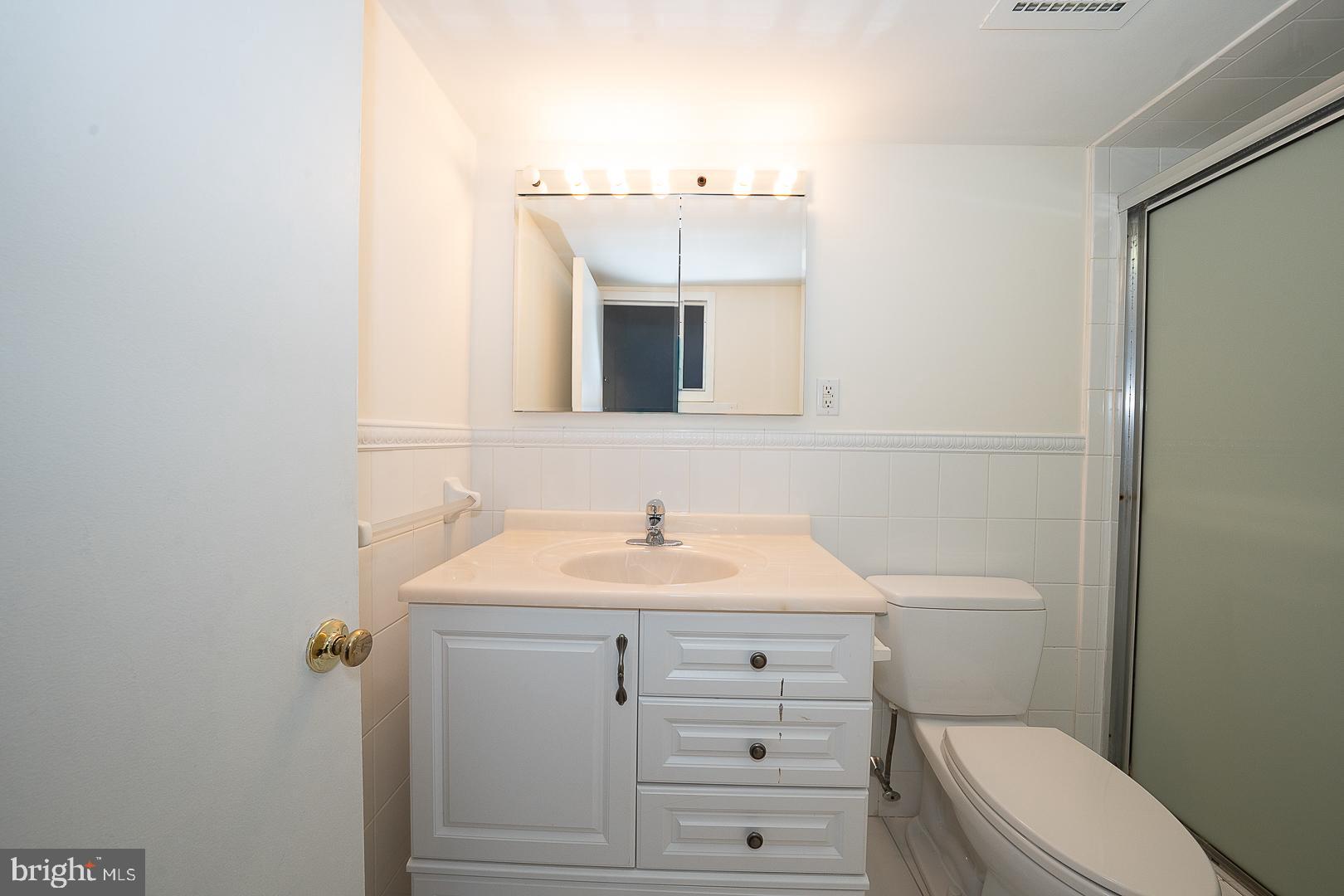 20 Conshohocken State Road, Unit 203 Bala Cynwyd, PA 19004 - Photo 21 of 35 a bathroom with a sink toilet and mirror