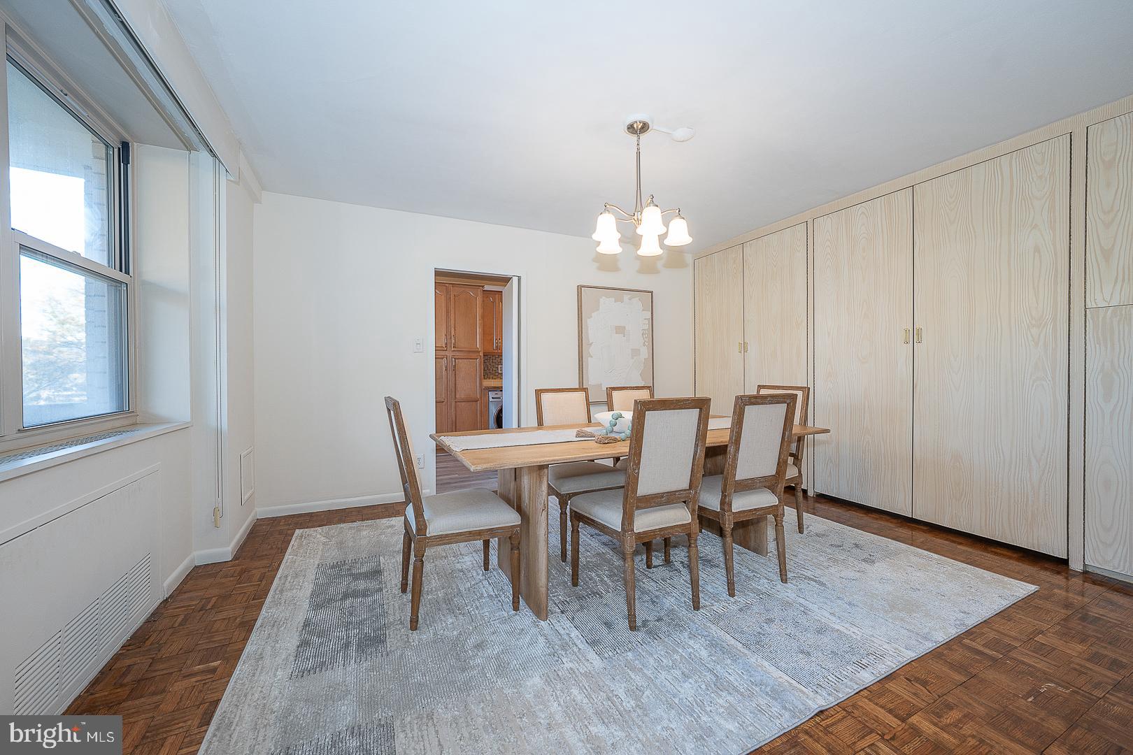 20 Conshohocken State Road, Unit 203 Bala Cynwyd, PA 19004 - Photo 8 of 35 a view of a dining room with furniture and chandelier