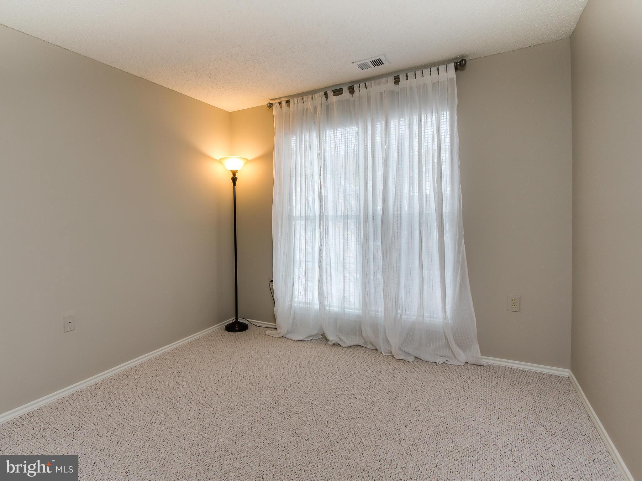 20991 Timber Ridge Terrace, Unit 303 Ashburn, VA 20147 - Photo 21 of 30 Bedroom