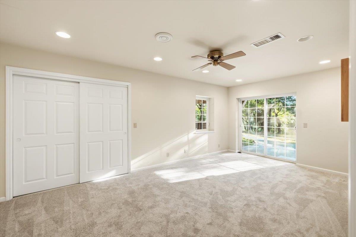 12531 Lowhills Road Nevada City, CA 95959 - Photo 46 of 92 a view of a livingroom with a chandelier fan and windows
