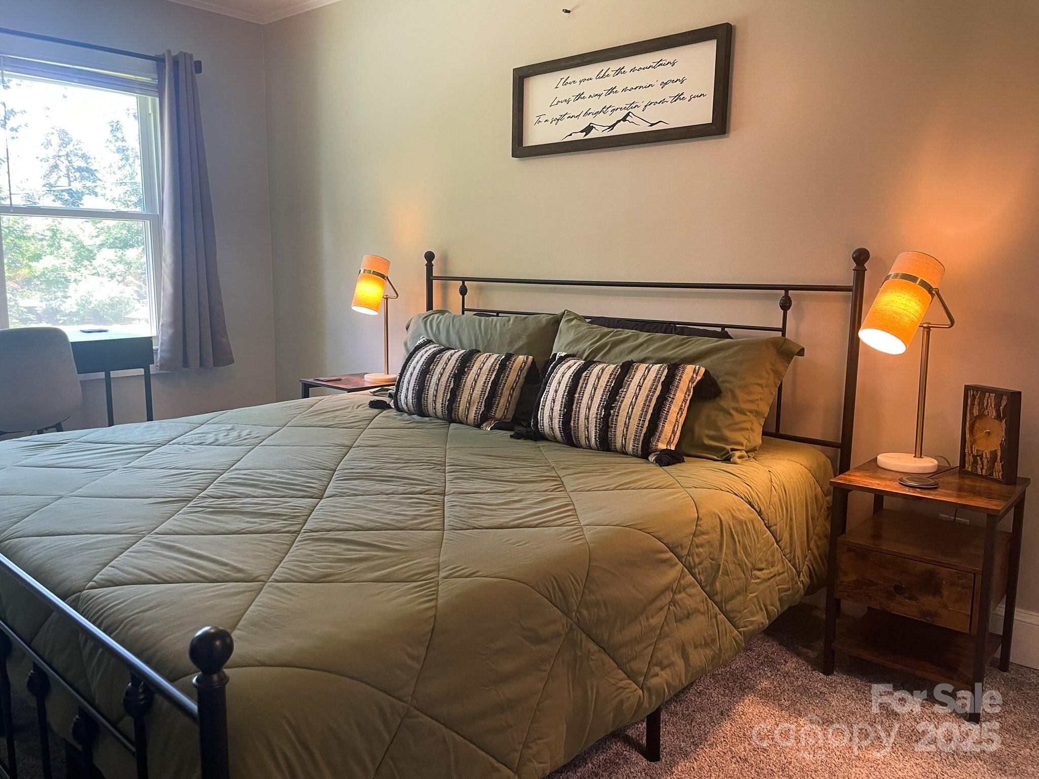 107 Byrd Street Morganton, NC 28655 - Photo 16 of 46 a bedroom with a bed and wooden floor