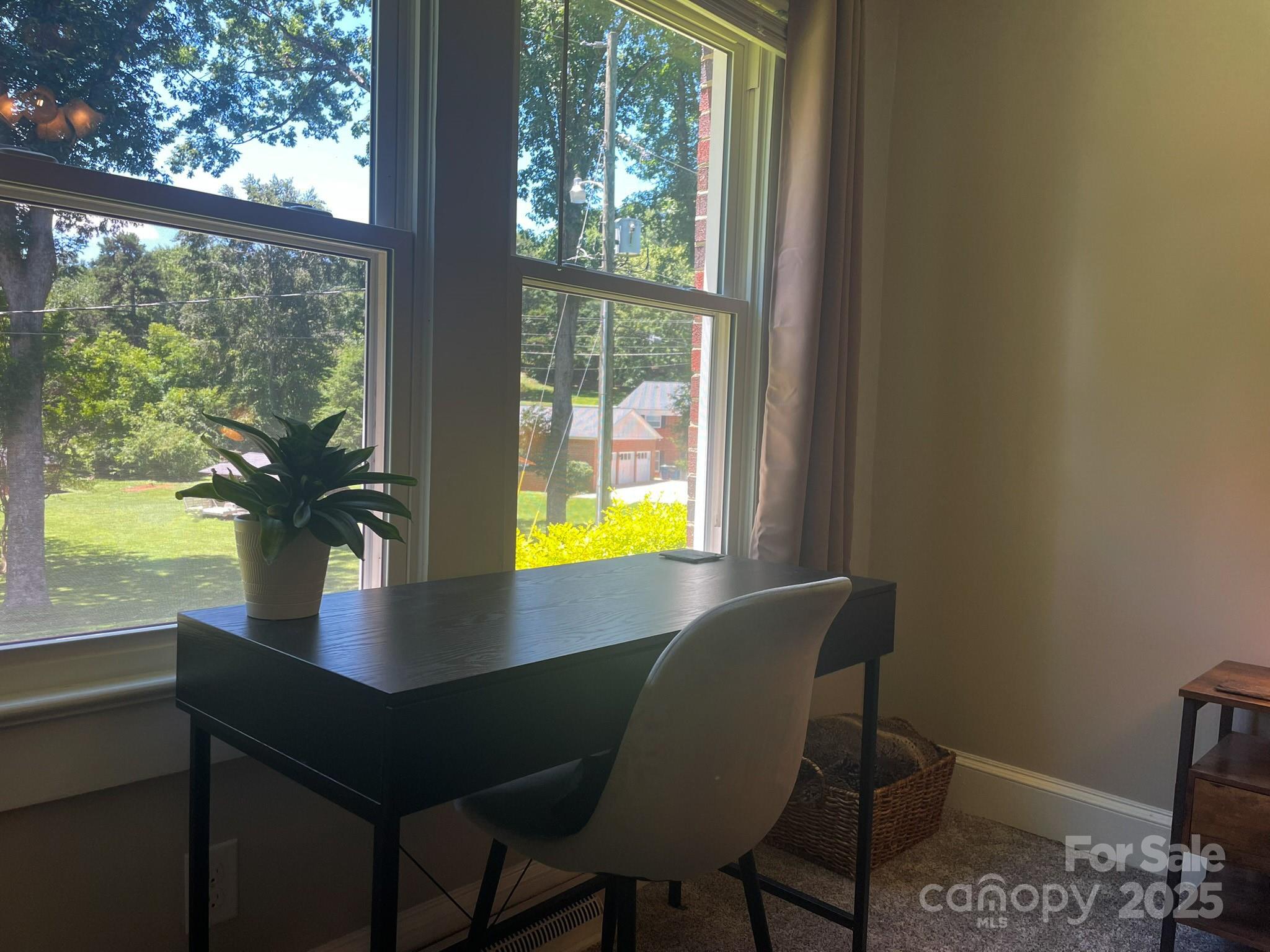 107 Byrd Street Morganton, NC 28655 - Photo 18 of 46 a view of a dining room with furniture and window