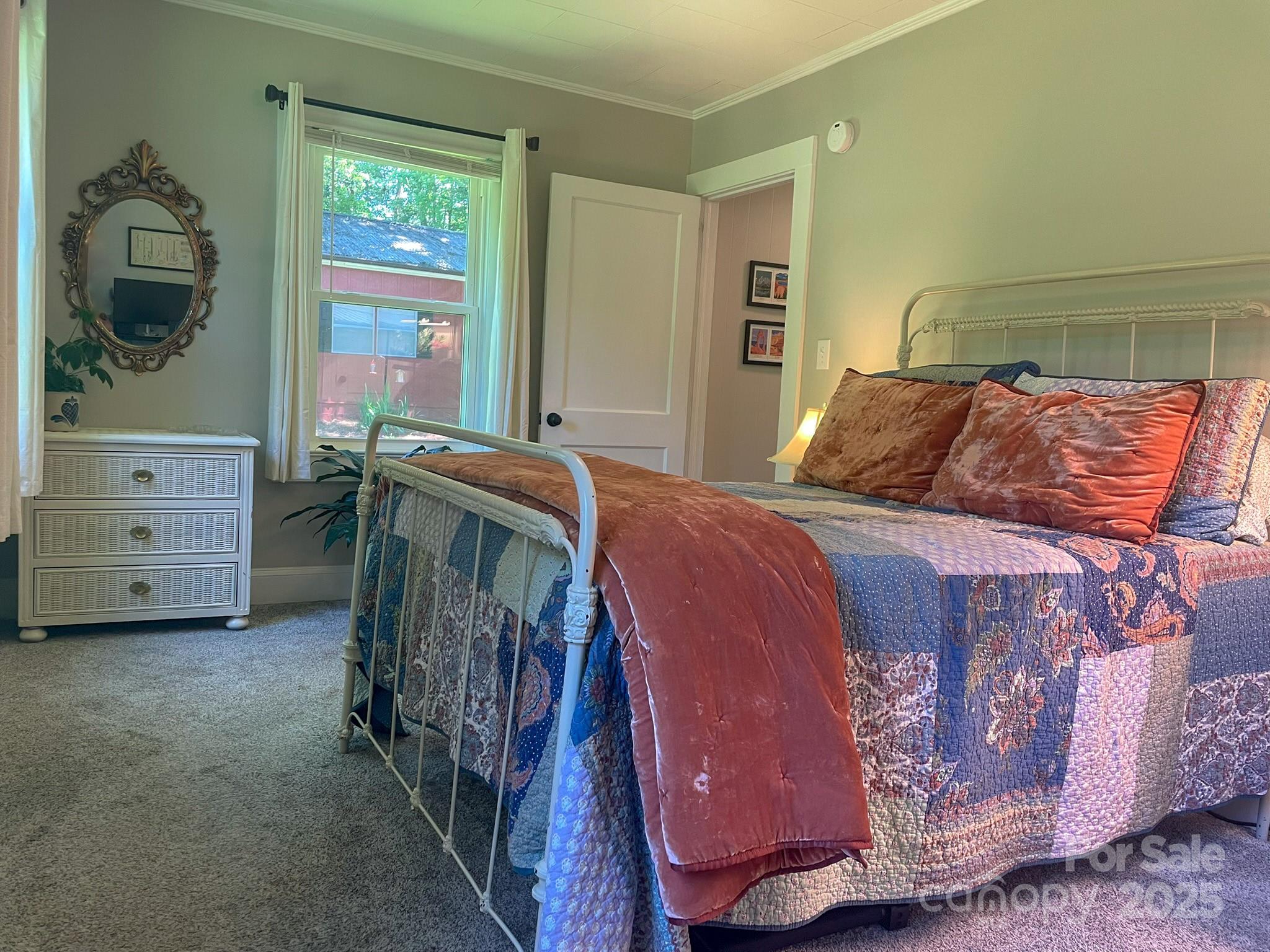 107 Byrd Street Morganton, NC 28655 - Photo 21 of 46 a bedroom with a bed and a window