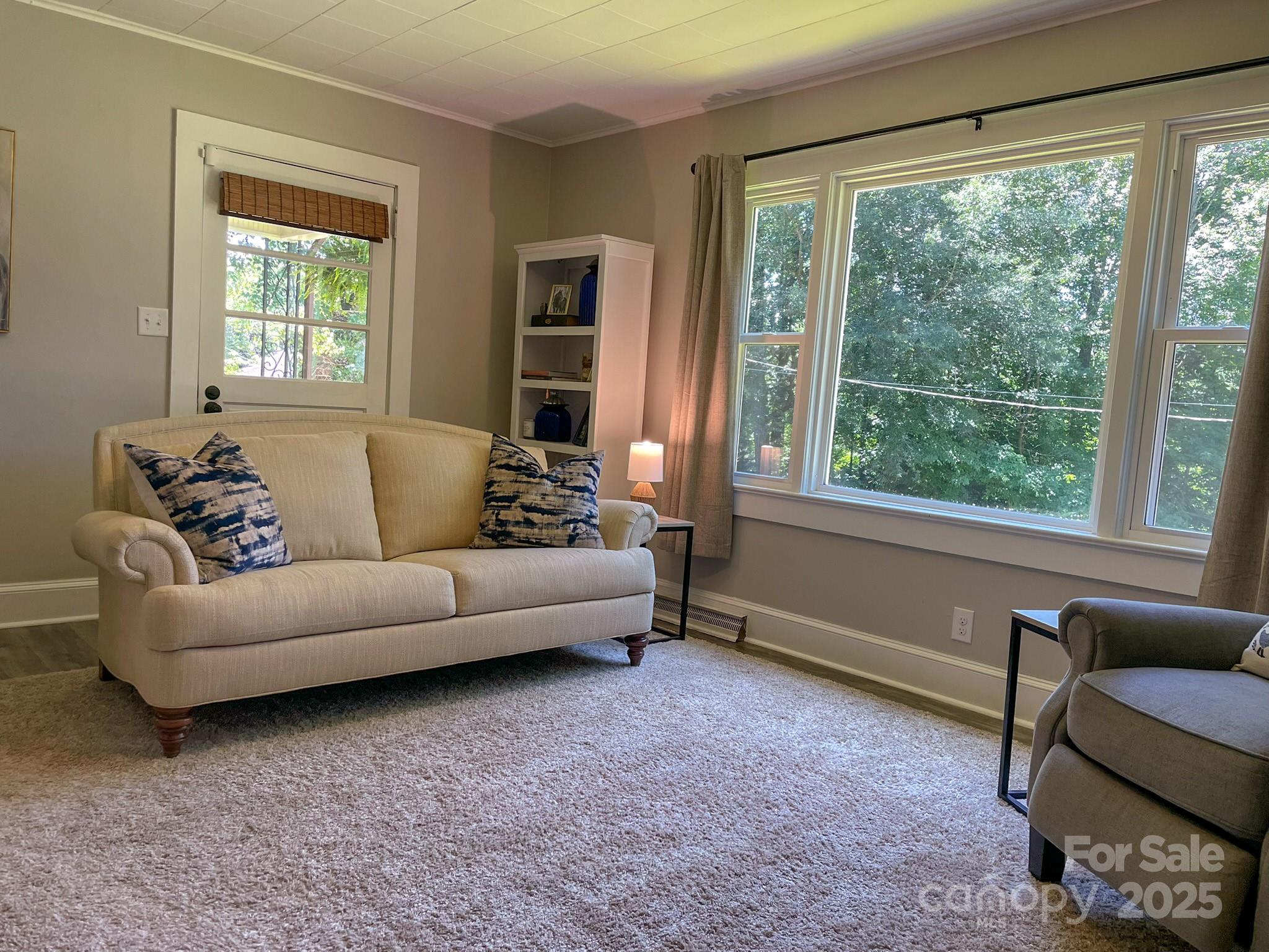 107 Byrd Street Morganton, NC 28655 - Photo 3 of 46 a living room with furniture and a large window