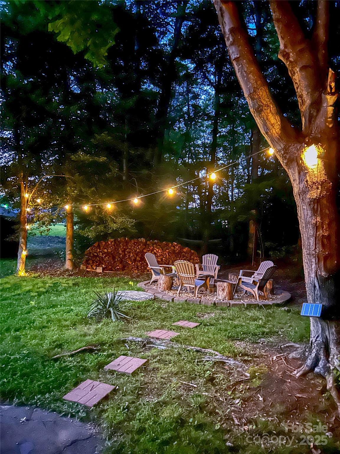 107 Byrd Street Morganton, NC 28655 - Photo 32 of 46 a view of a backyard with a garden