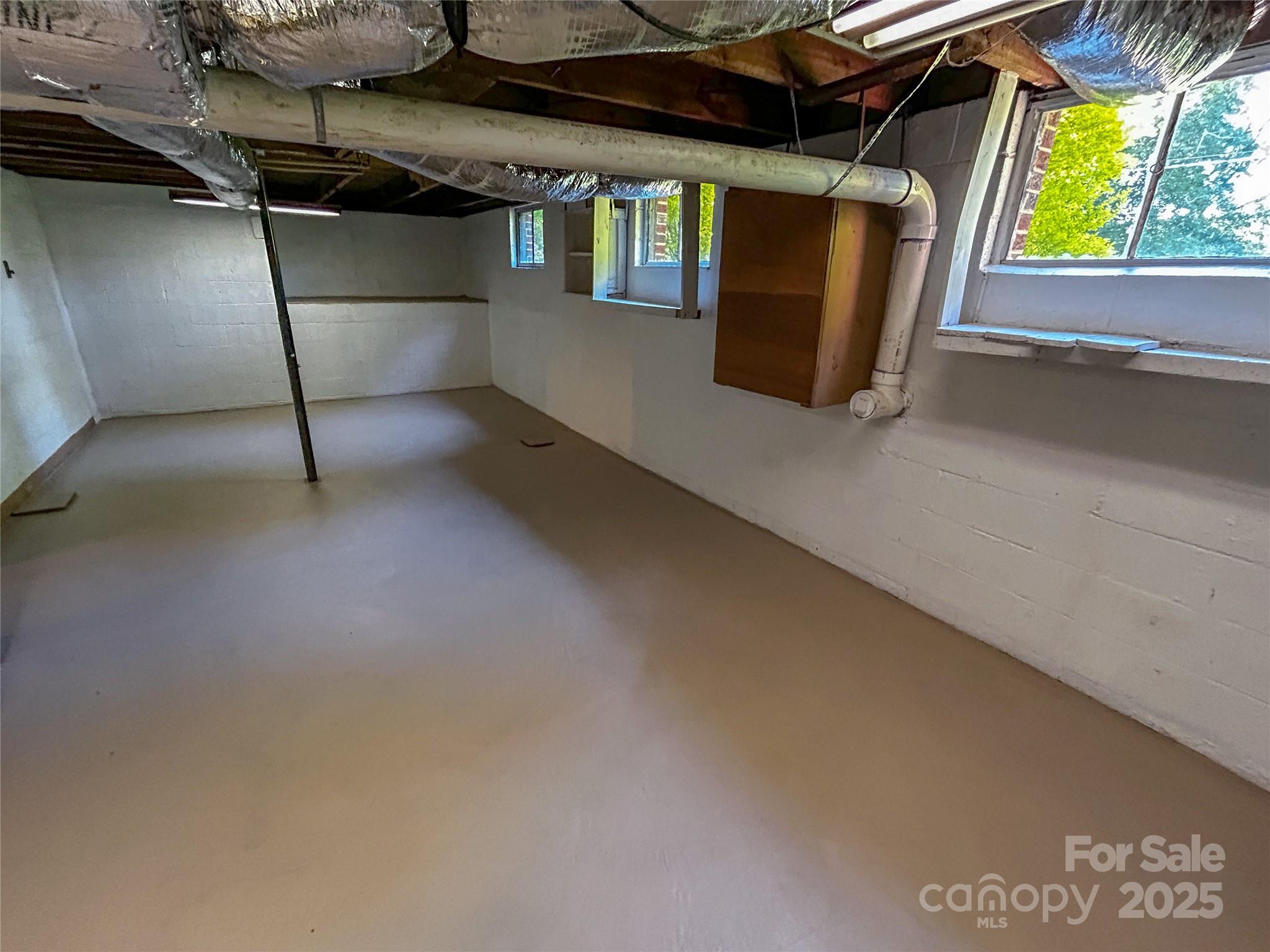 107 Byrd Street Morganton, NC 28655 - Photo 34 of 46 a storage room with stairs