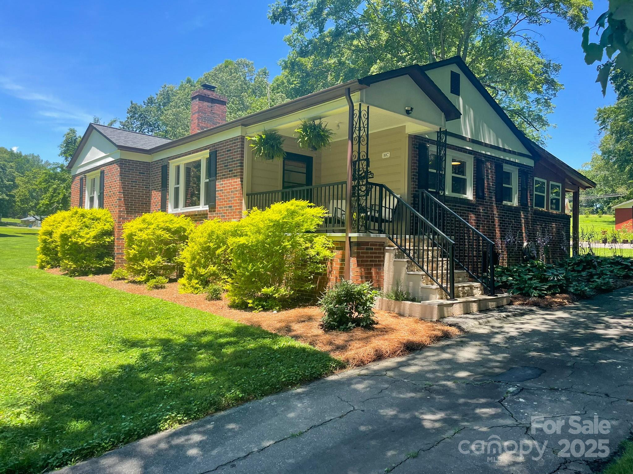 107 Byrd Street Morganton, NC 28655 - Photo 46 of 46 a front view of house with a garden