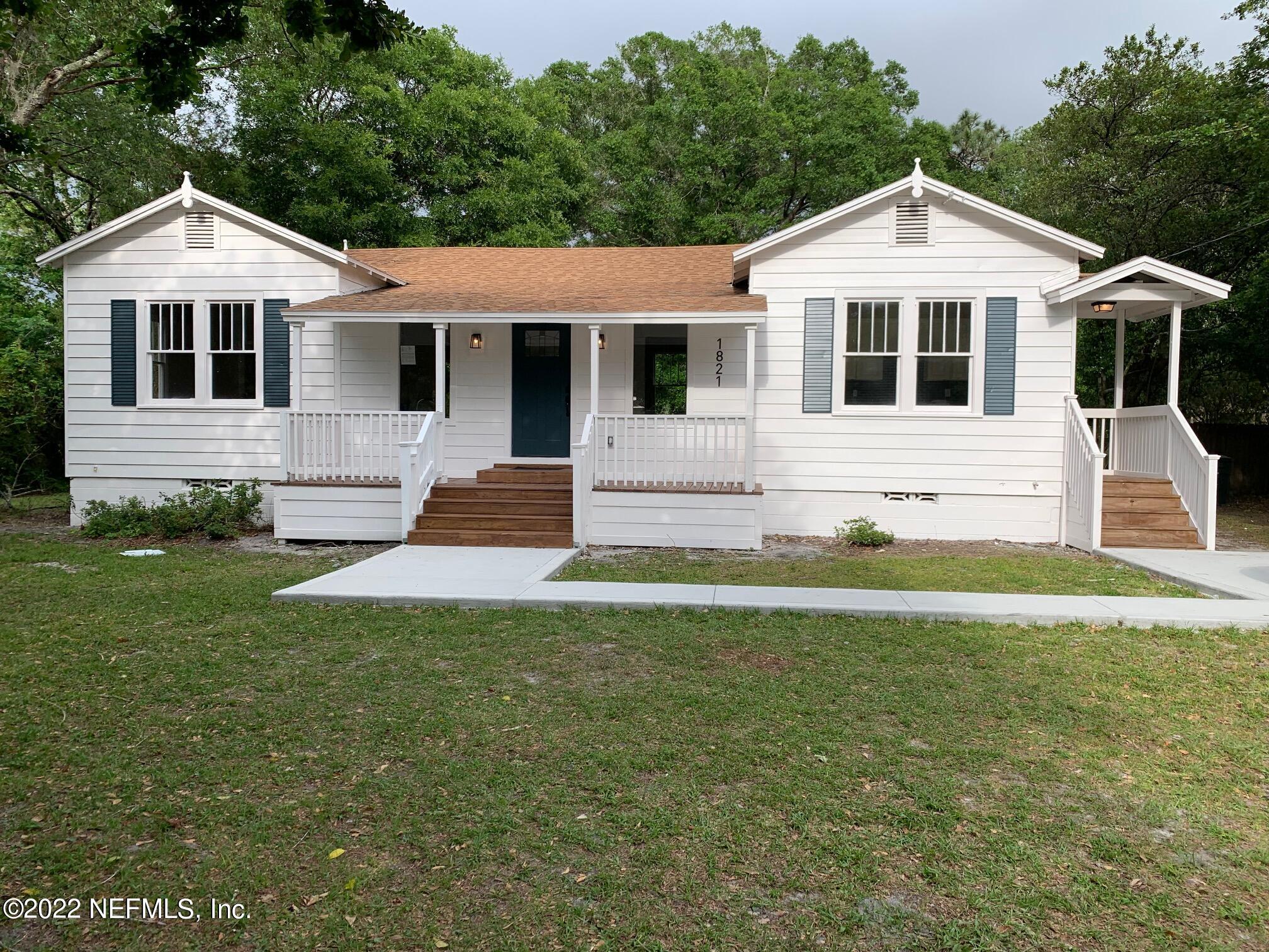 1821 Anniston Road Jacksonville, FL 32246 - Photo 1 of 11 a front view of a house with a yard