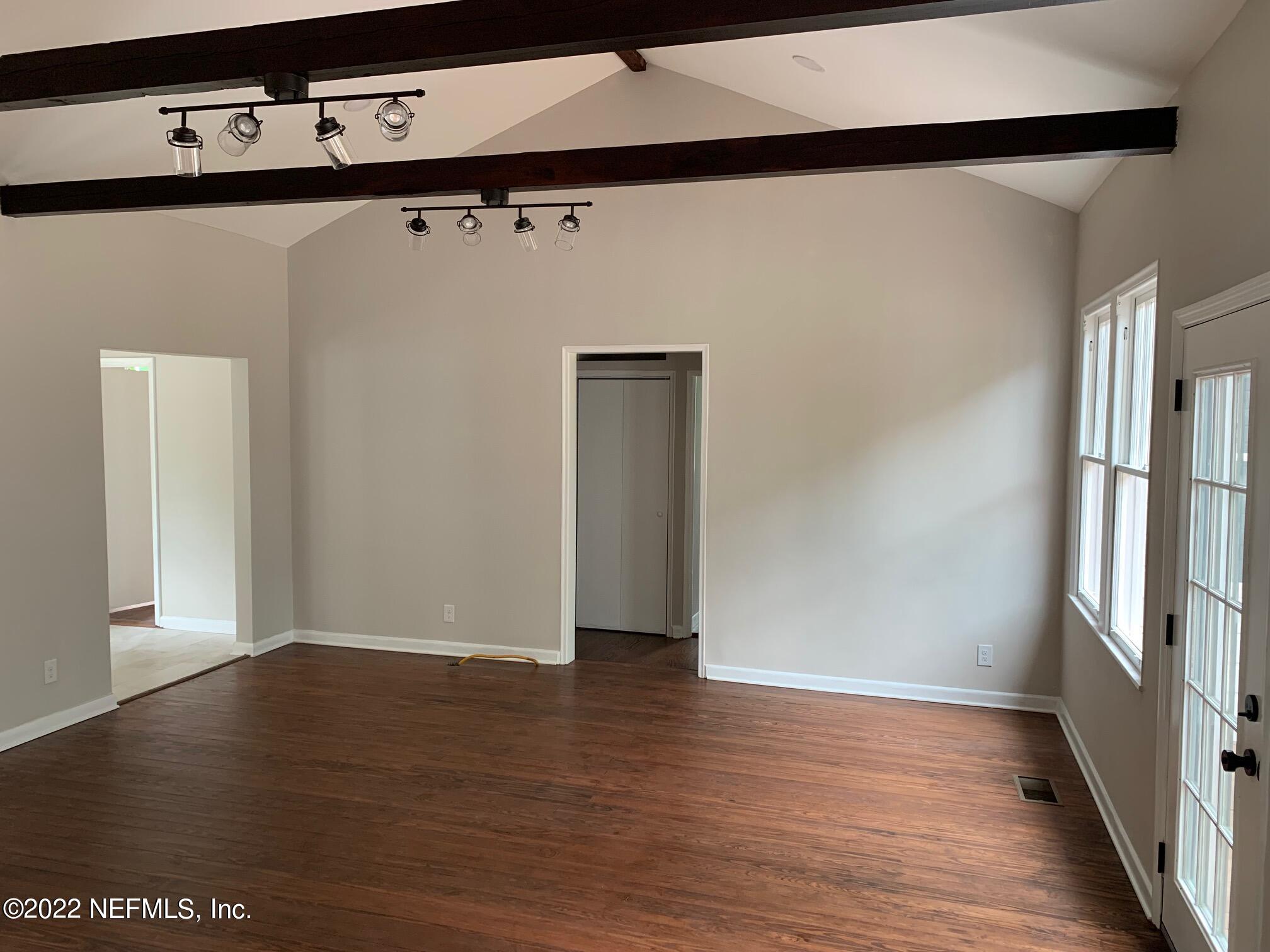 1821 Anniston Road Jacksonville, FL 32246 - Photo 4 of 11 a view of an empty room with wooden floor