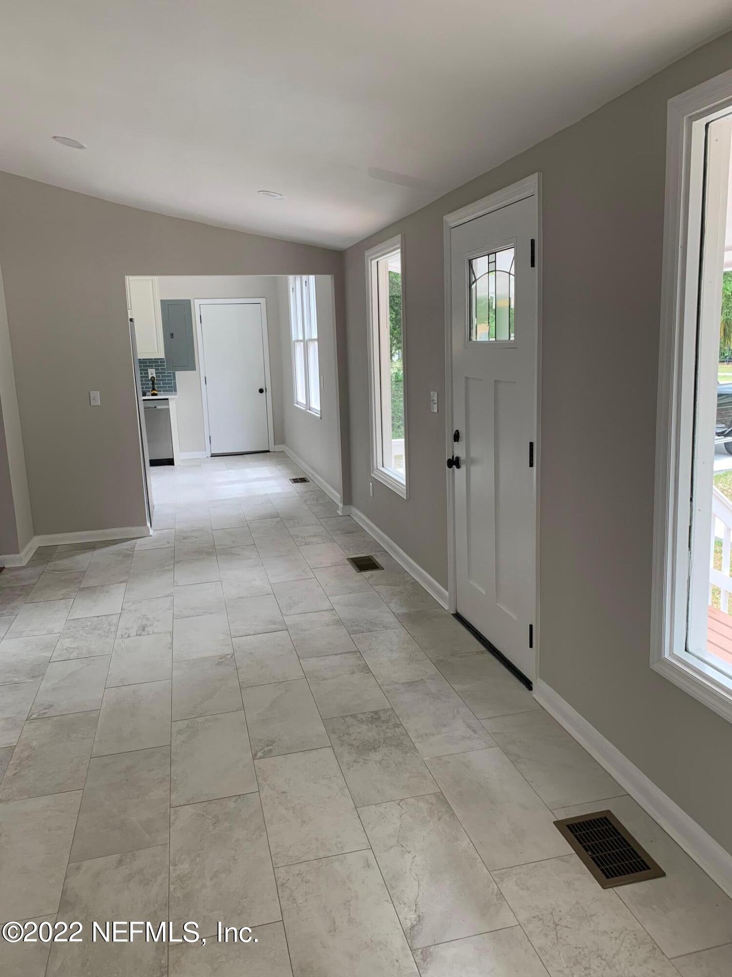 1821 Anniston Road Jacksonville, FL 32246 - Photo 9 of 11 a view of an empty room with window and bathroom