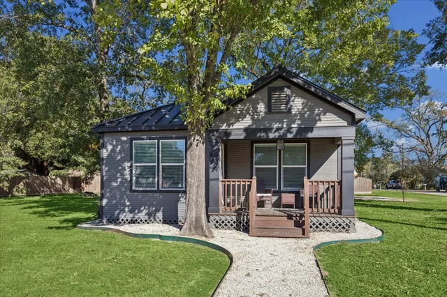 a front view of a house with garden