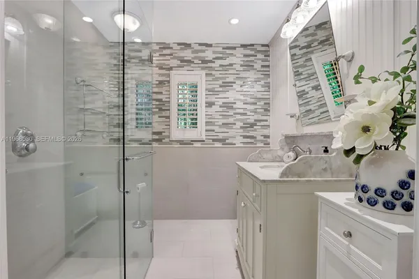 a bathroom with a sink and a shower