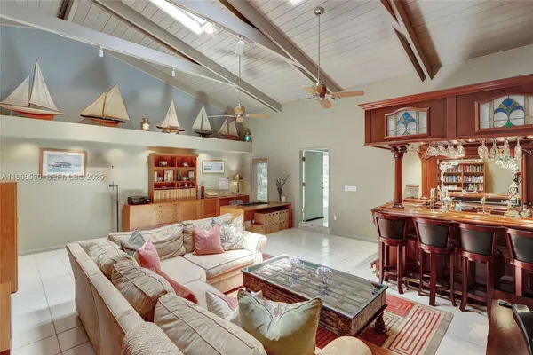 a living room with fireplace furniture and a flat screen tv