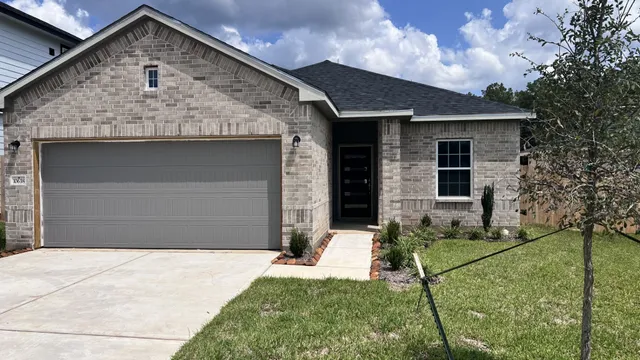 a front view of a house with yard