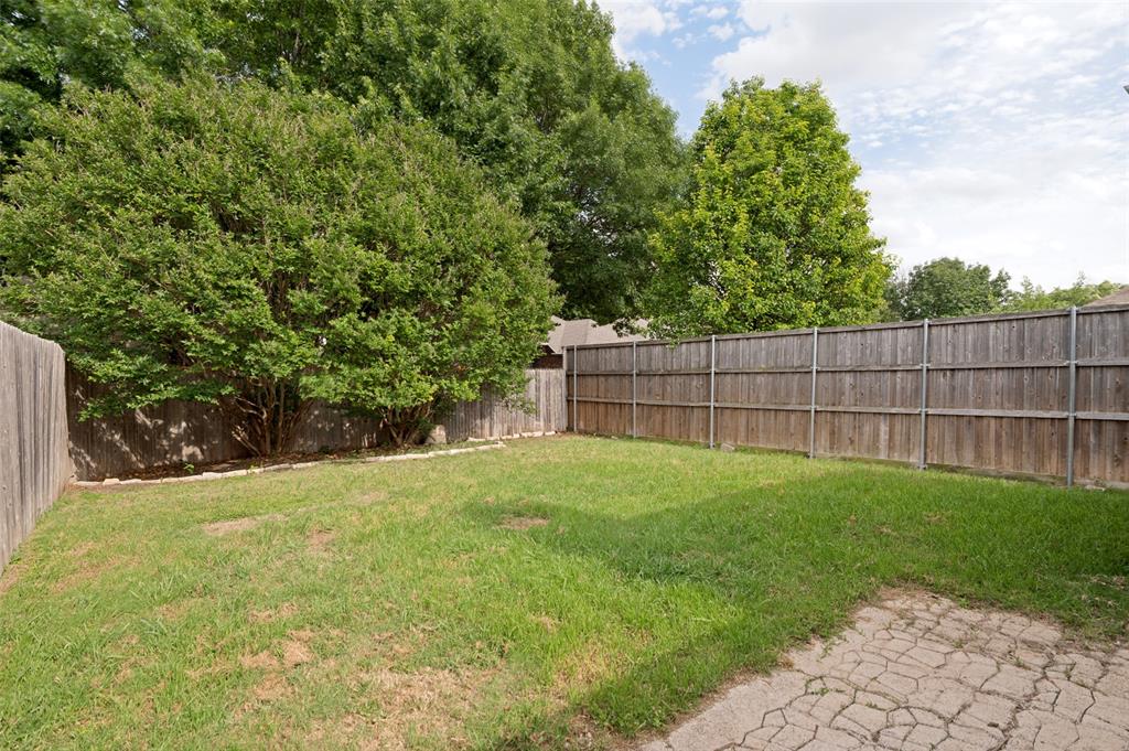 8160 Tower Road Frisco, TX 75035 - Photo 24 of 25 a view of a backyard with a tree