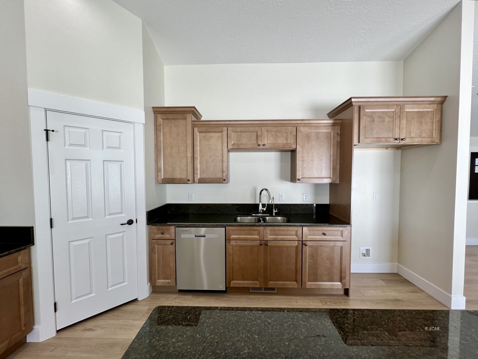 410 Ridgeway Drive Spring Creek, NV 89815 - Photo 6 of 26 a kitchen with stainless steel appliances granite countertop a sink a stove a refrigerator and cabinets