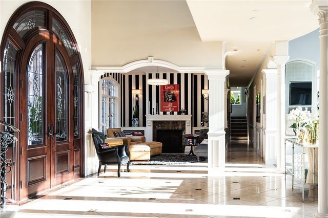 a view of a lobby with a door and windows