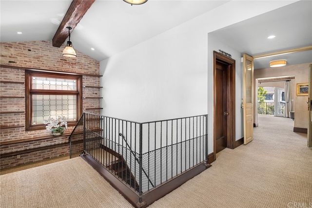 a view of hallway with windows