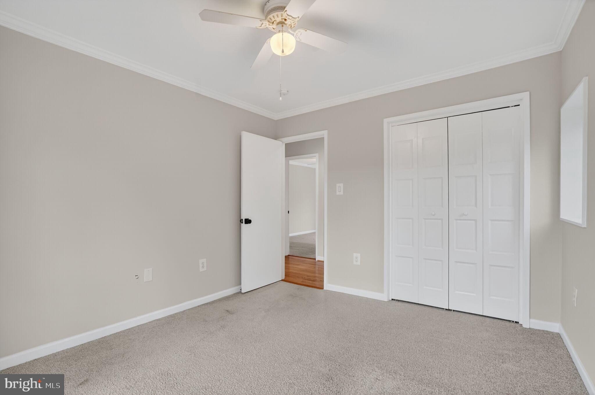 3052 Sugar Lane Vienna, VA 22181 - Photo 15 of 28 a view of an empty room and chandelier fan