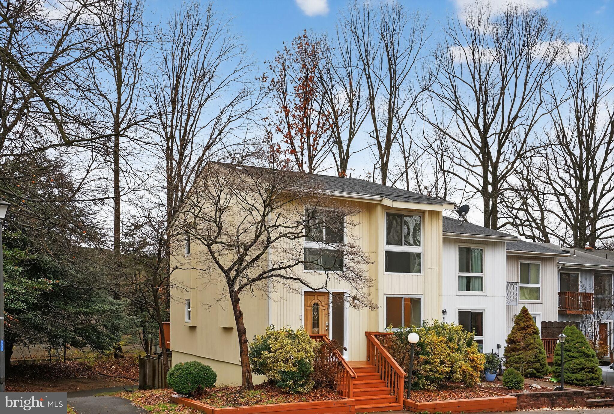 3052 Sugar Lane Vienna, VA 22181 - Photo 2 of 28 a front view of a house with garden