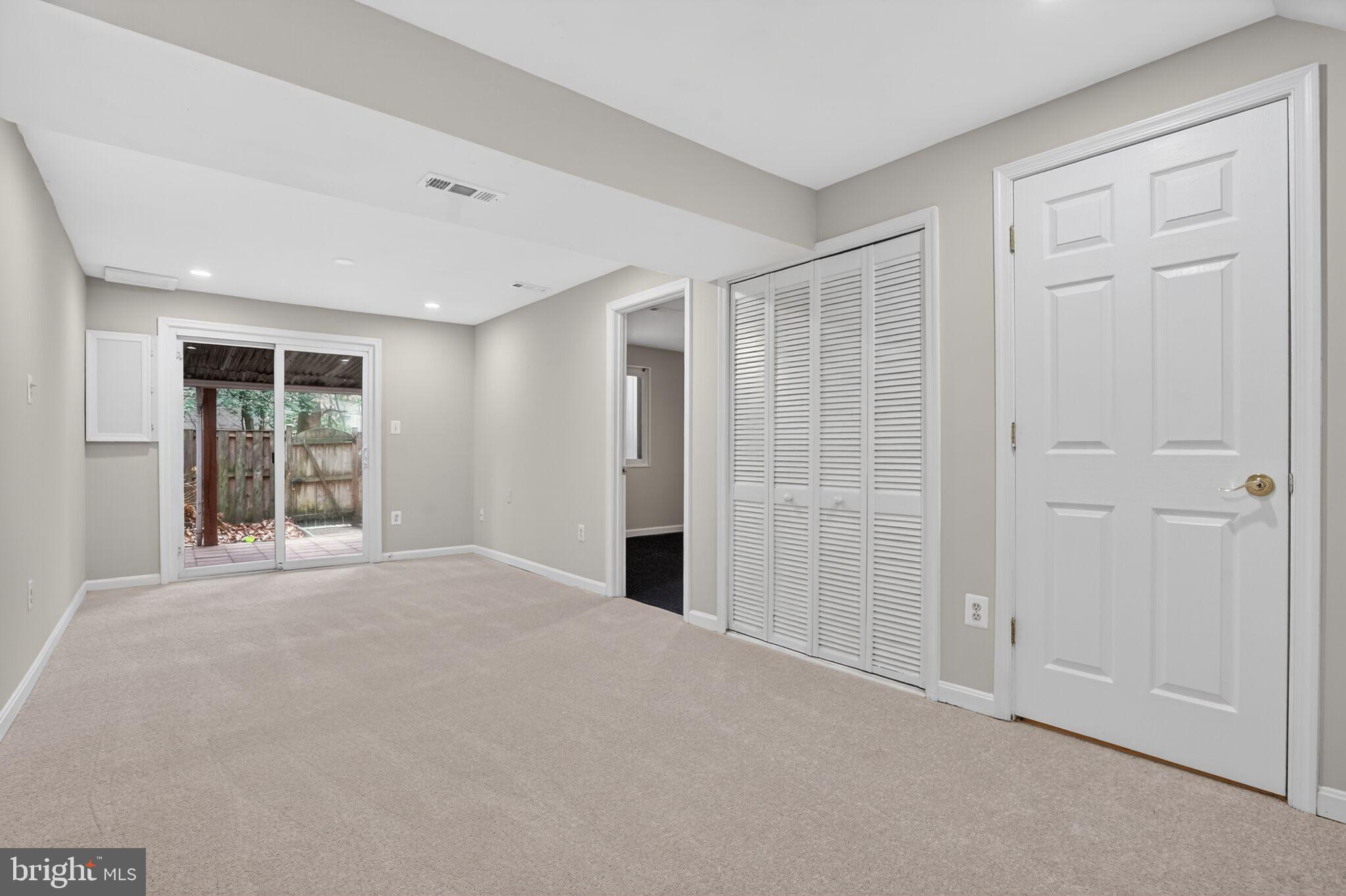 3052 Sugar Lane Vienna, VA 22181 - Photo 21 of 28 a view of an empty room with glass door and balcony
