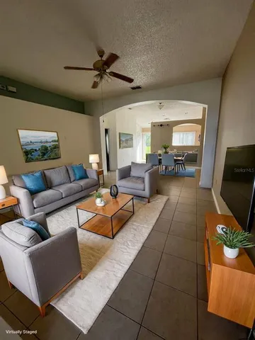 a living room with furniture and a flat screen tv