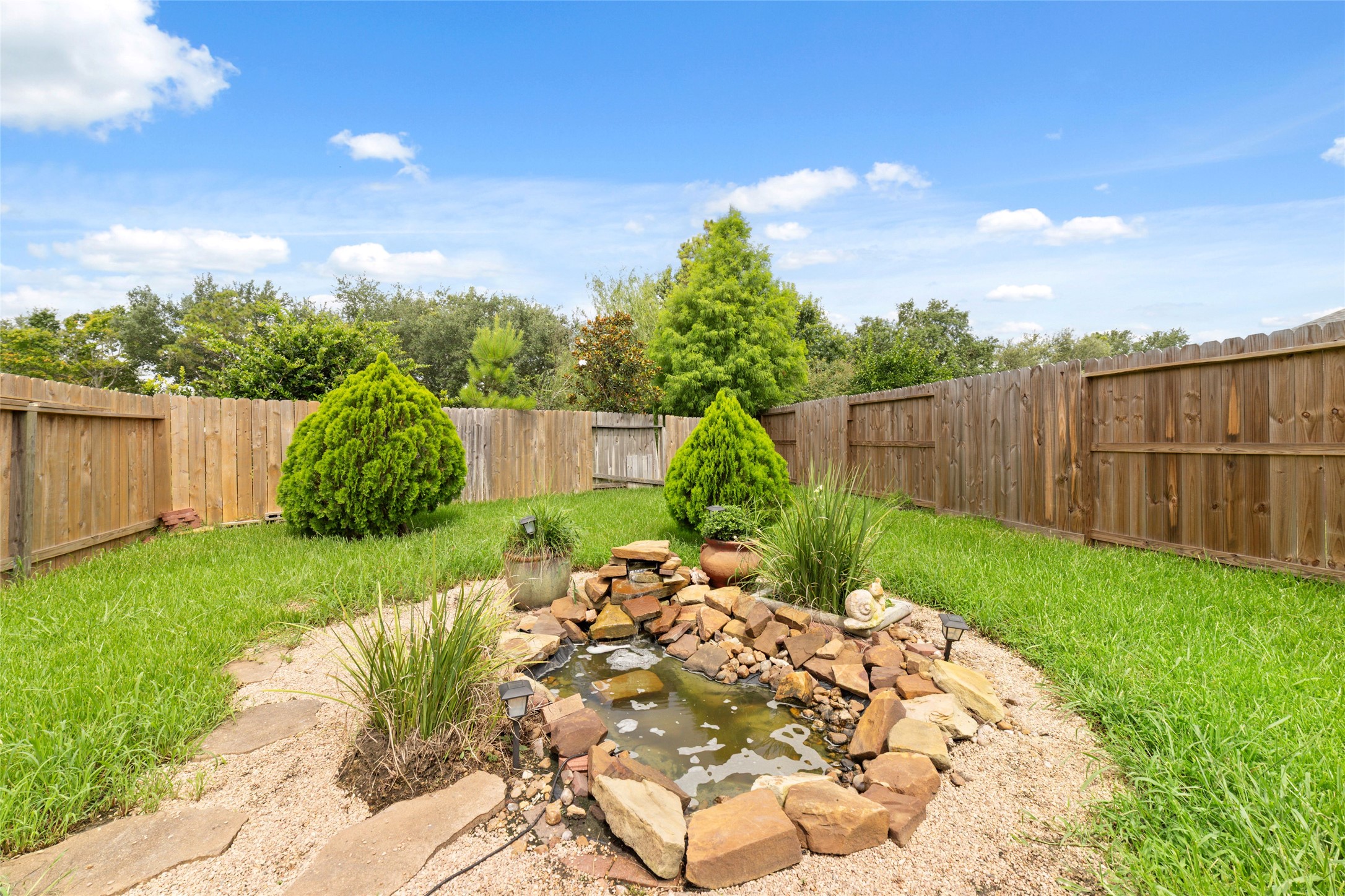 13605 Trail Meadow Lane Rosharon, TX 77583 - Photo 20 of 21 Generous size backyard with a pond
