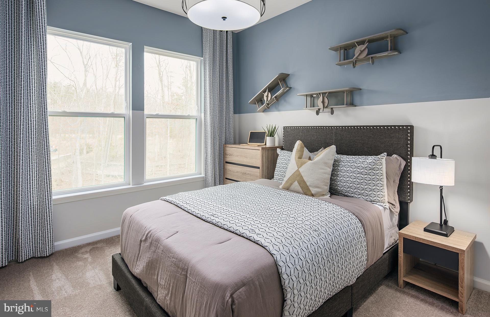 210 Mainstream Drive Laurel, MD 20724 - Photo 11 of 29 a bedroom with a bed and a window