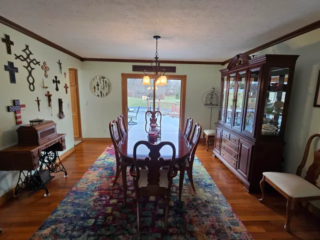 a living room with furniture and a mirror