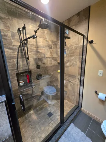 a living room with furniture and a gym