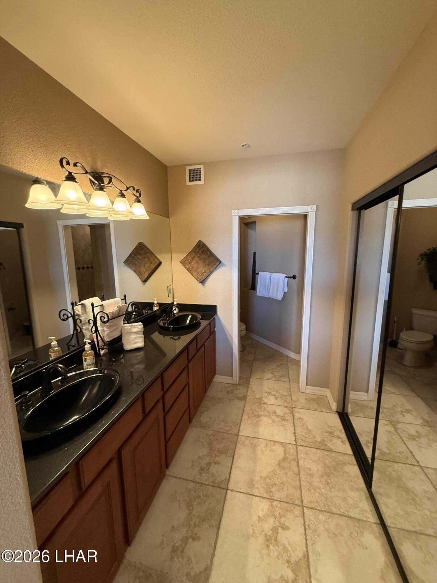 433 London Bridge Road, Unit B101 Lake Havasu City, AZ 86403 - Photo 25 of 35 a kitchen with a sink and a stove top oven