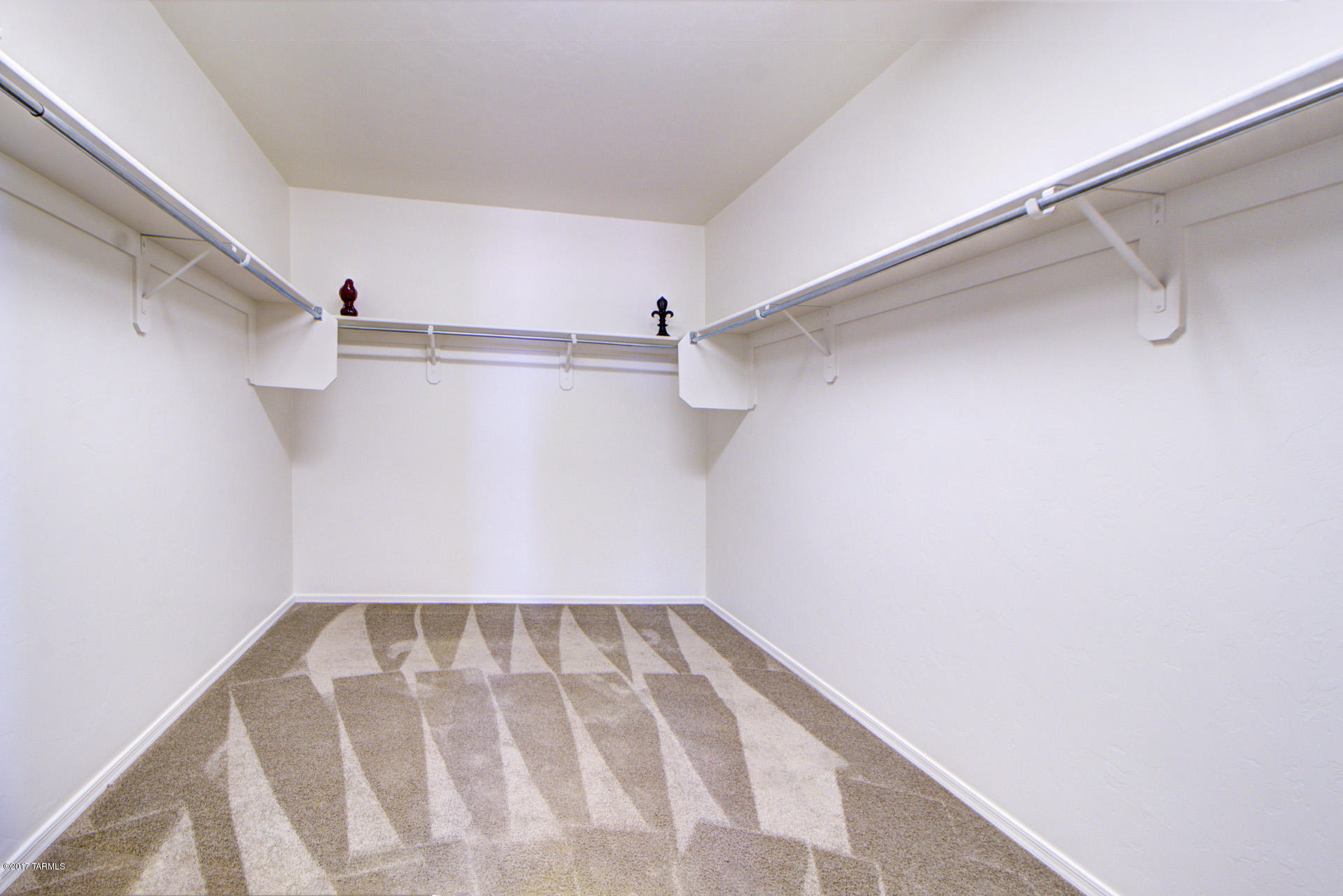 3588 East Mecate Road Tucson, AZ 85739 - Photo 25 of 36 a view of a room with racks on the wall