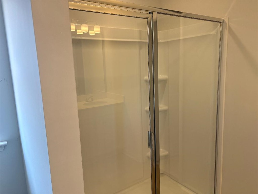 129 Cedar Shoals Easley, SC 29640 - Photo 17 of 31 A well-maintained shower stall with a clear glass enclosure.