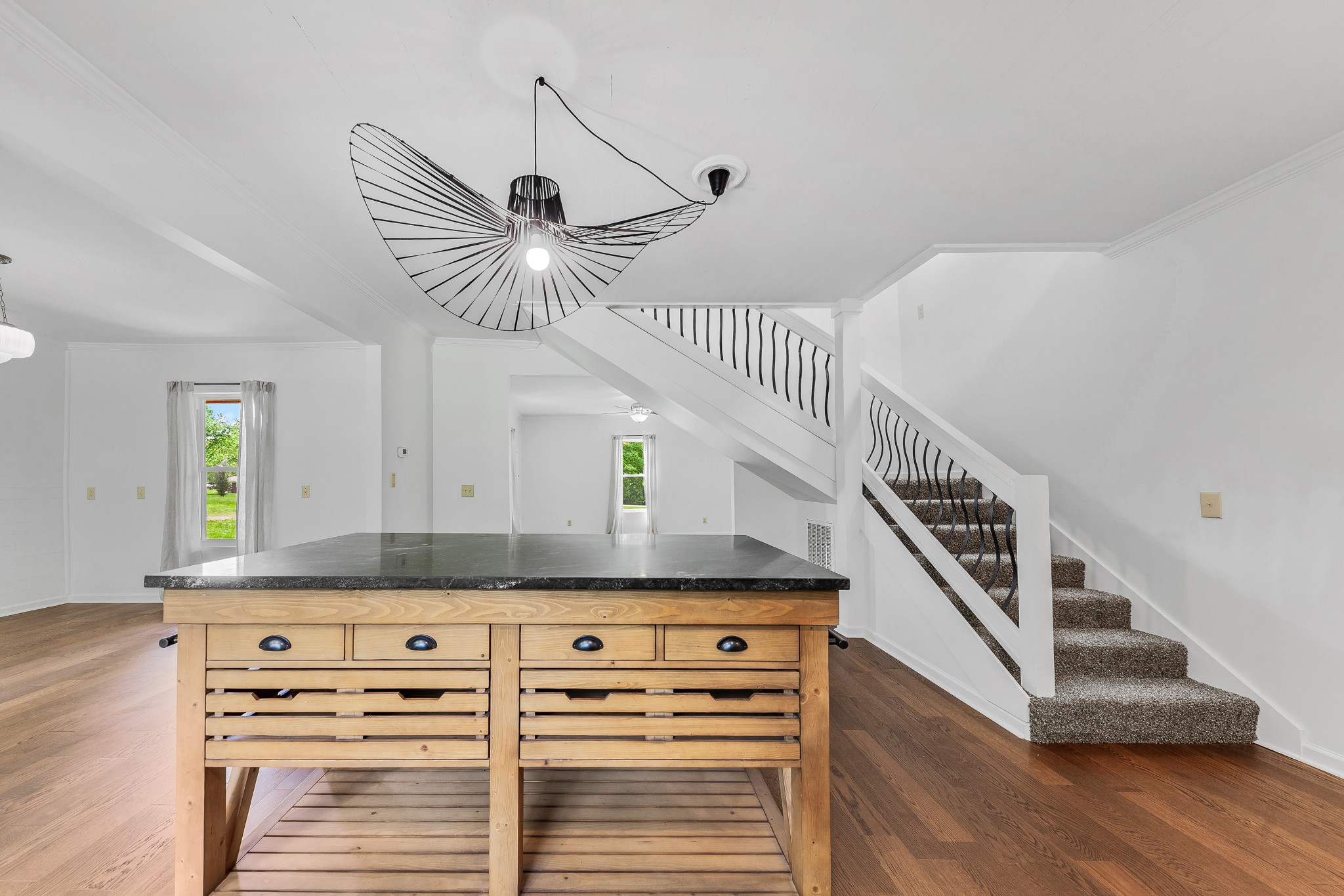 128 North Main Street Loretto, TN 38469 - Photo 13 of 32 a kitchen with granite countertop a stove and a chandelier