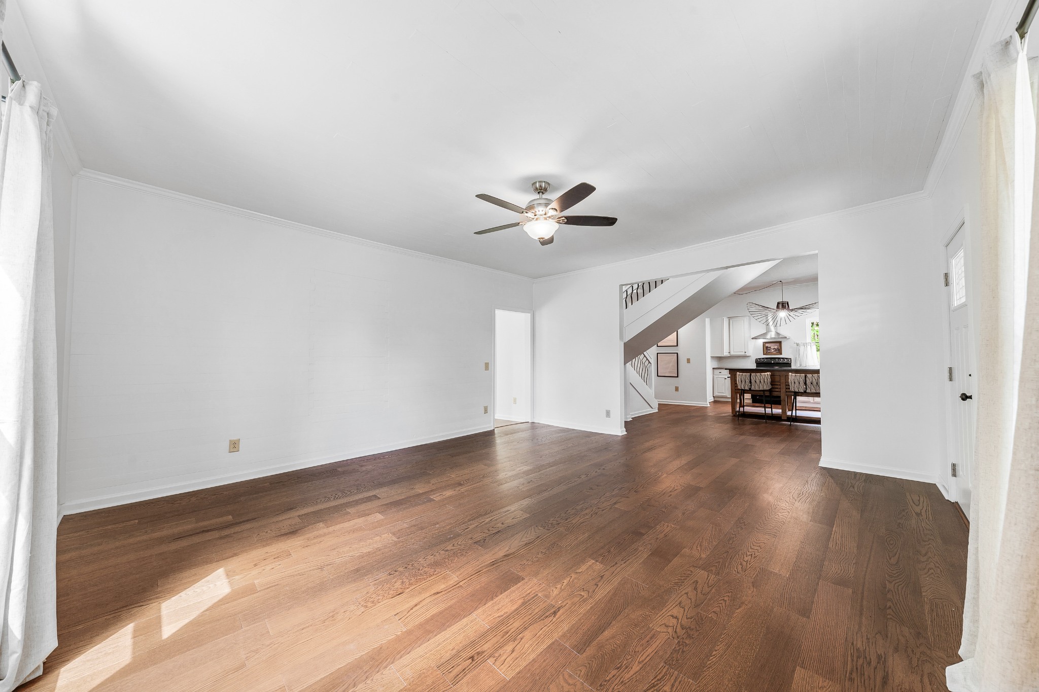 128 North Main Street Loretto, TN 38469 - Photo 14 of 32 a view of empty room with wooden floor and ceiling fan