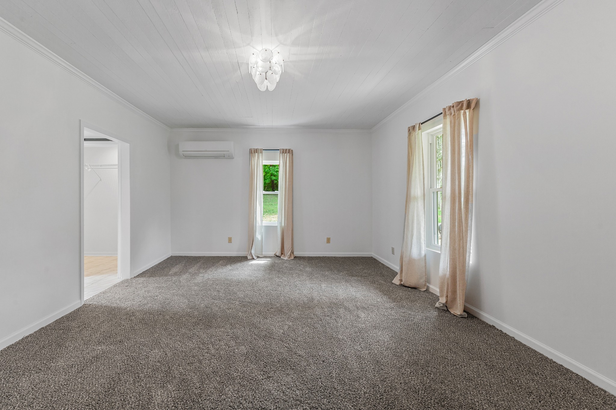 128 North Main Street Loretto, TN 38469 - Photo 16 of 32 an empty room with a window and chandelier fan