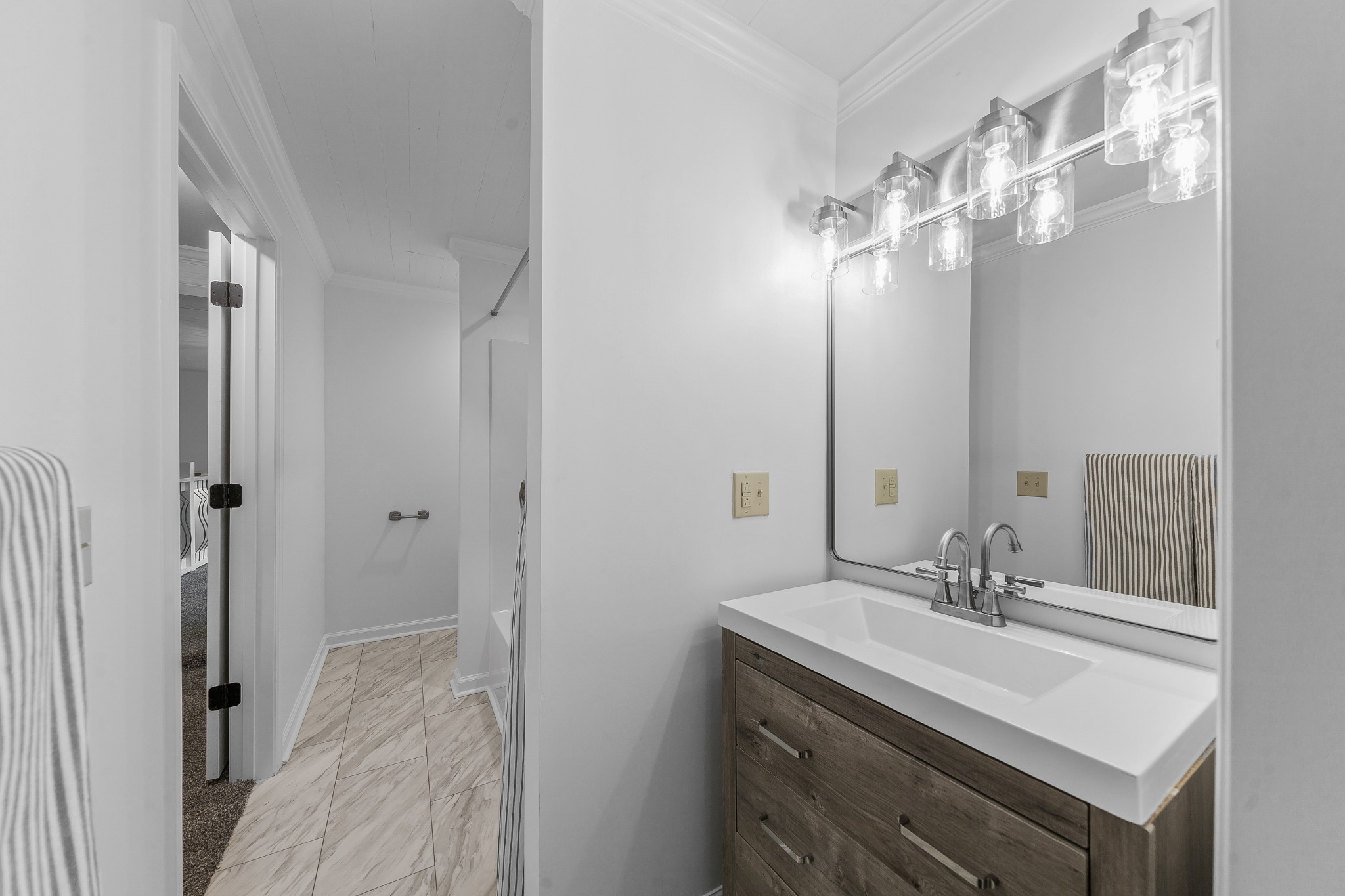 128 North Main Street Loretto, TN 38469 - Photo 28 of 32 a bathroom with a sink vanity and a mirror