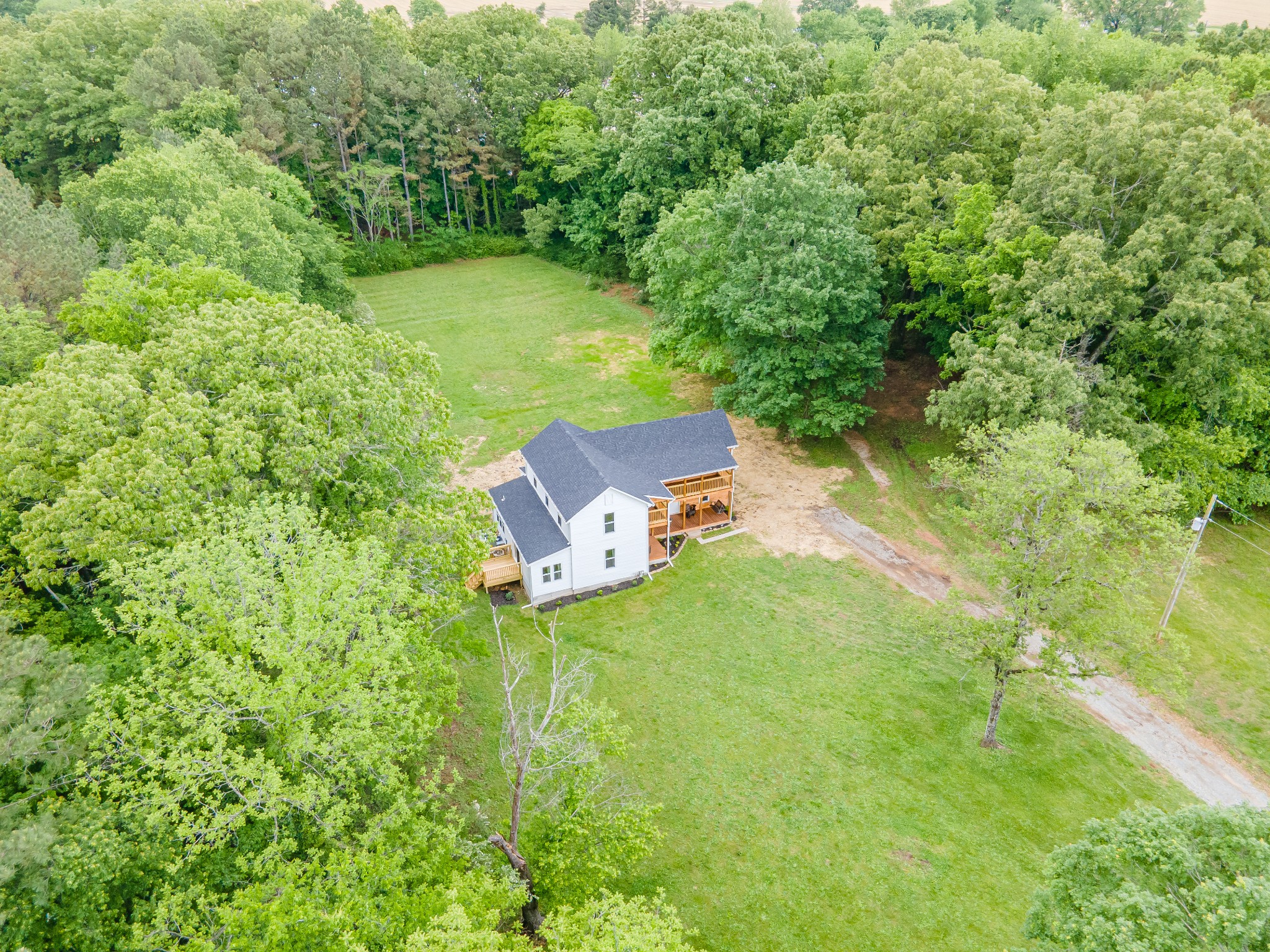 128 North Main Street Loretto, TN 38469 - Photo 30 of 32 an aerial view of a house with a yard