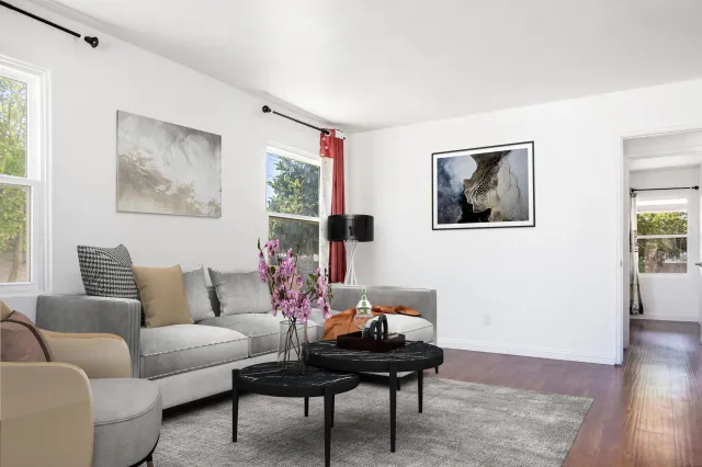 a living room with furniture and a table
