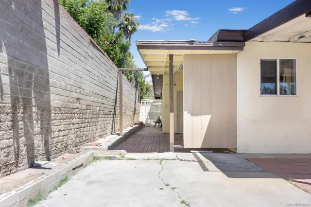 a view of a house with a door and wooden floor