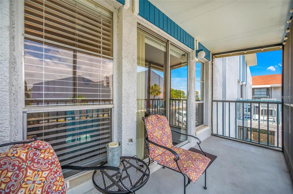 260 Medallion Boulevard, Unit F Madeira Beach, FL 33708 - Photo 19 of 29 a living room with furniture and a window