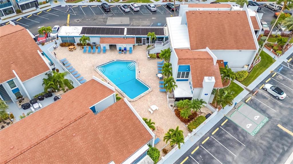 260 Medallion Boulevard, Unit F Madeira Beach, FL 33708 - Photo 25 of 29 an aerial view of residential houses with outdoor space