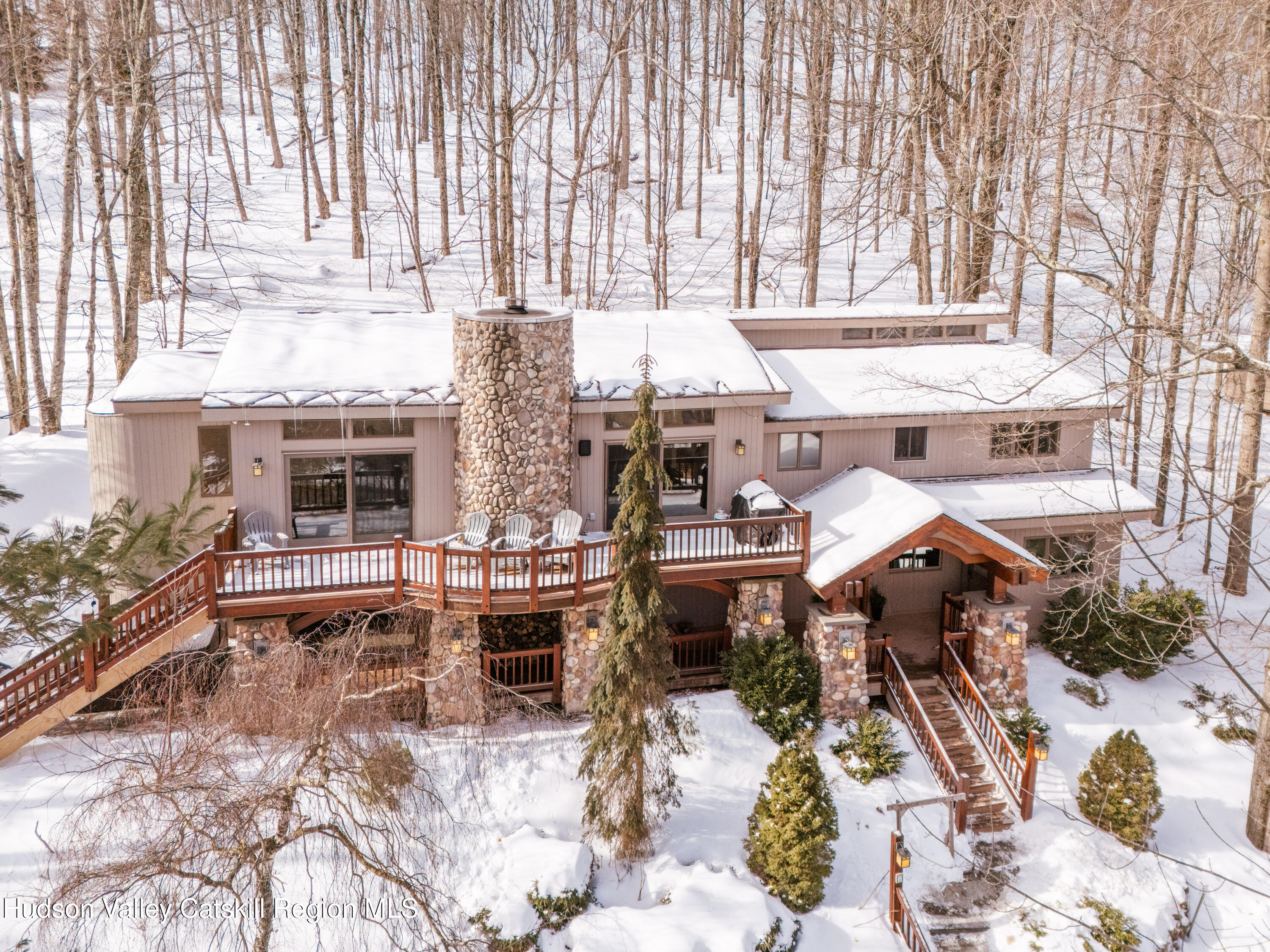 a view of a patio with table and chairs and potted plants