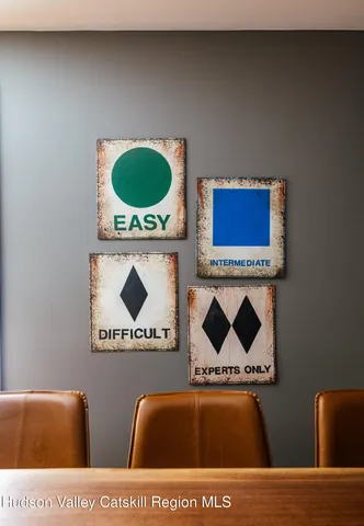 a bathroom with a granite countertop sink and a bathtub