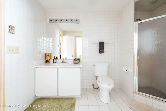 a bathroom with a toilet and a window