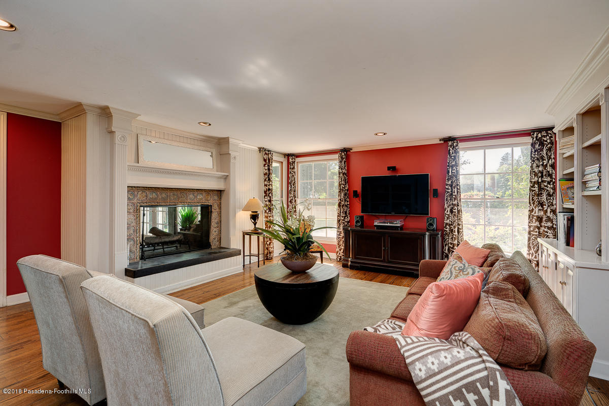 721 Madre Street Pasadena, CA 91107 - Photo 24 of 82 a living room with furniture a flat screen tv and a fireplace