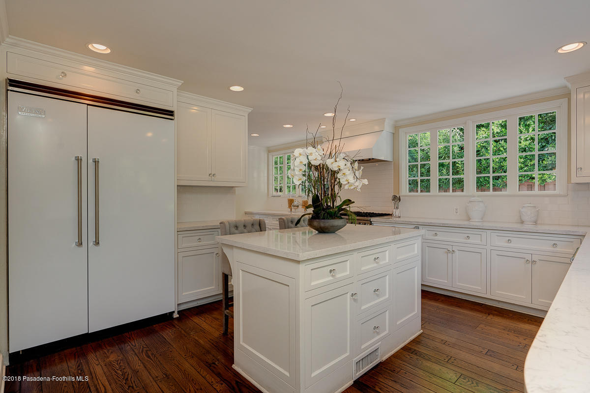 721 Madre Street Pasadena, CA 91107 - Photo 31 of 82 a kitchen with white cabinets and white appliances